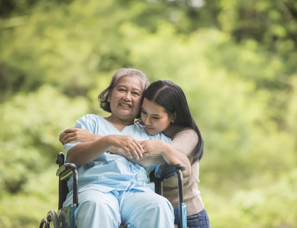 Silver Leaf caregiver embracing NDIS participant in Alice Springs